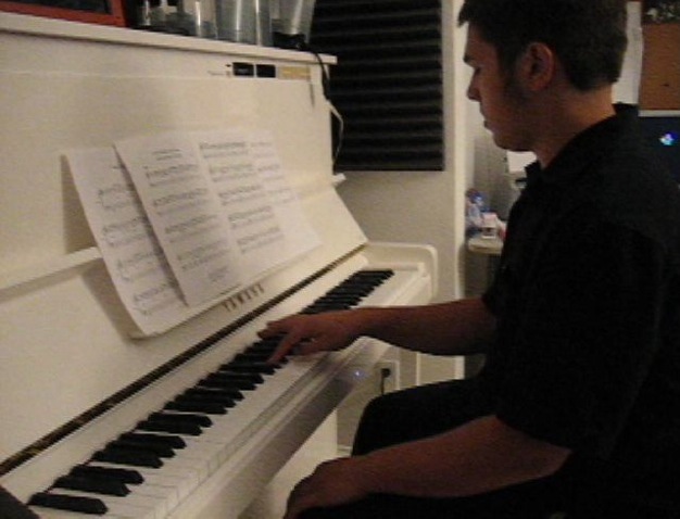Student Joel
                Hill at a jazz piano lesson